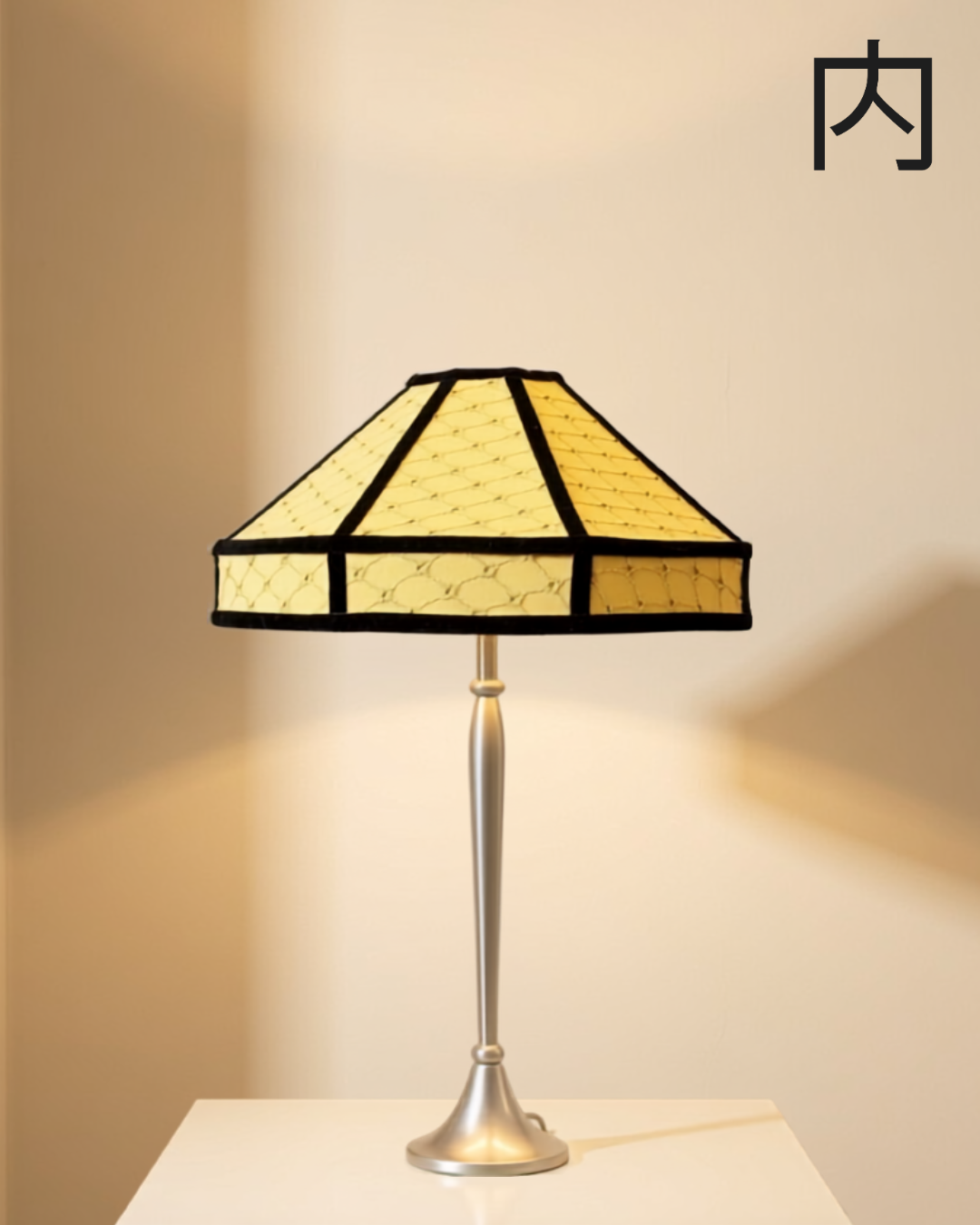 Bloom lampshade - tiered, pagoda-style lampshade in soft ochre fabric with quilted diamond stitching and black velvet trim